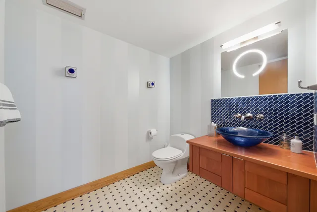 a swimming pool with a large window and chandelier