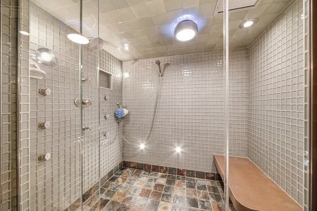 a room with pool table and paintings on the wall