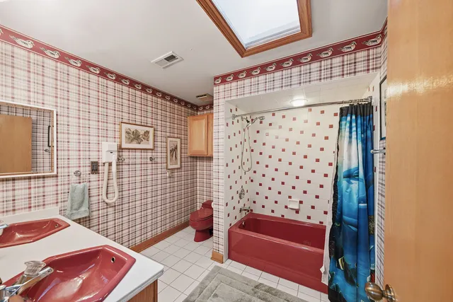 a bedroom with furniture and a flat screen tv