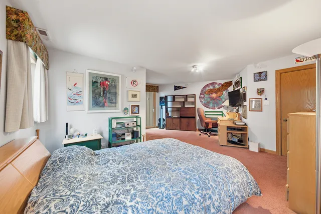 a living room with furniture and large windows