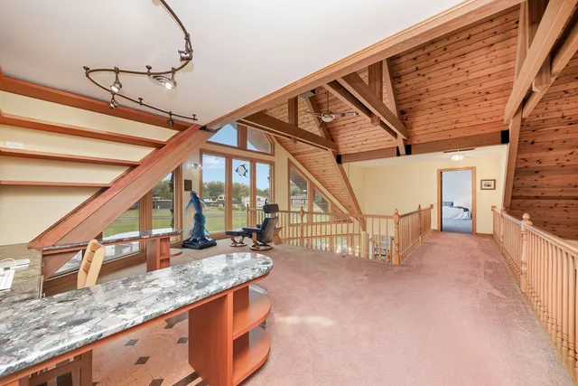 a spacious bedroom with a bed and a window