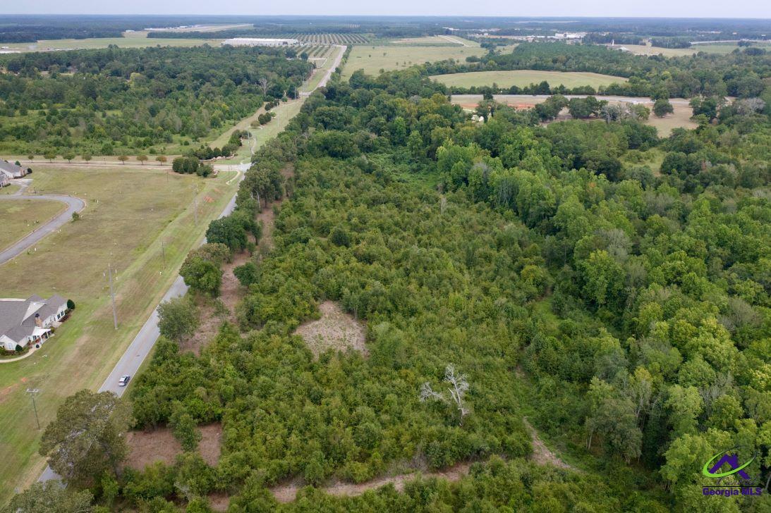 Airport Road Perry, GA 31069 - Photo 14 of 23 a view of a lush green forest with trees and houses