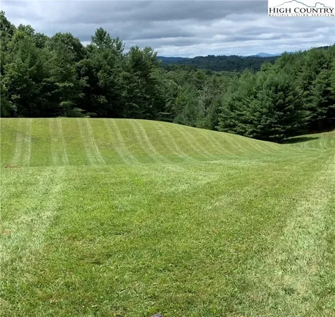 a view of a field with an outdoor space