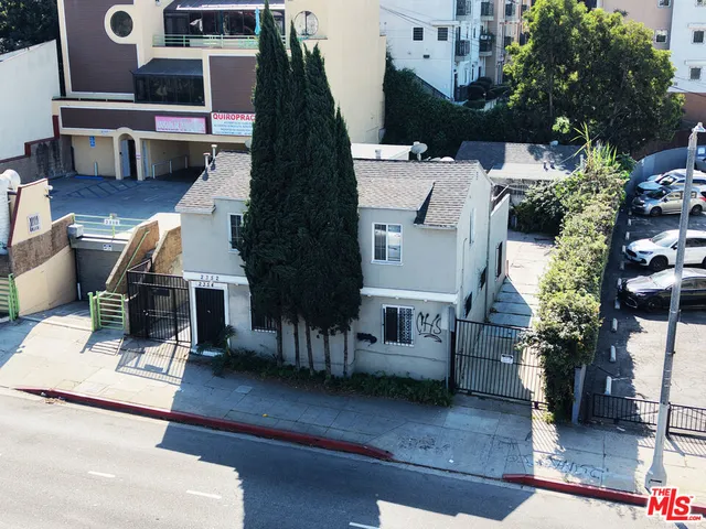 an aerial view of a house with swimming pool