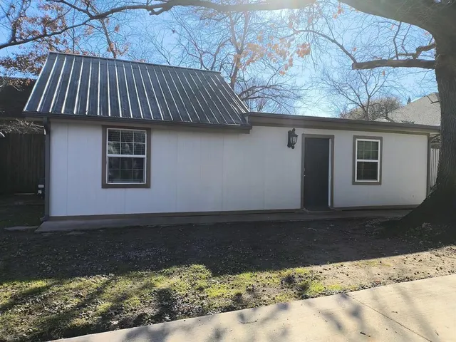 a view of backyard of house