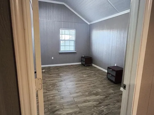 a bathroom with a granite countertop sink a toilet and a mirror