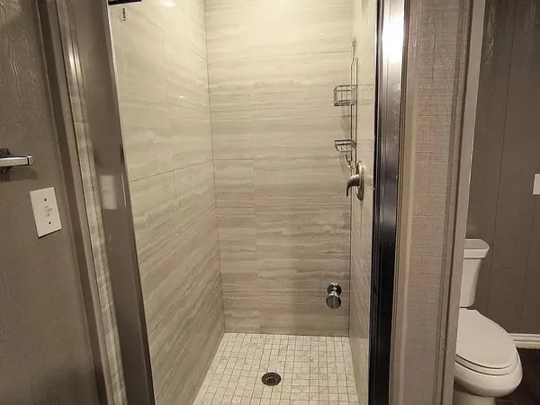 a view of a backyard with wooden fence