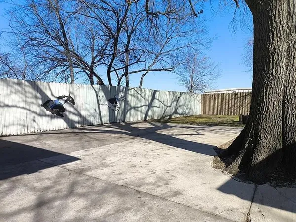 a backyard of a house with yard and trees