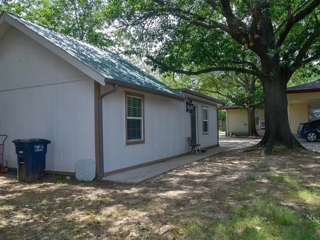 a house view with a backyard space