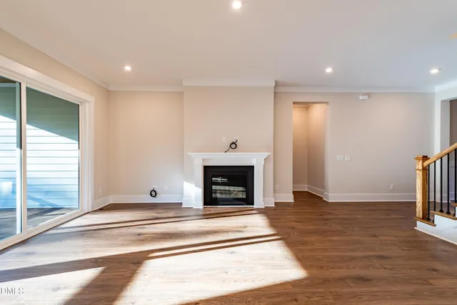 a view of kitchen with a sink and wooden floor