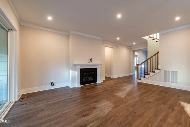 a view of a kitchen cabinets and wooden floor