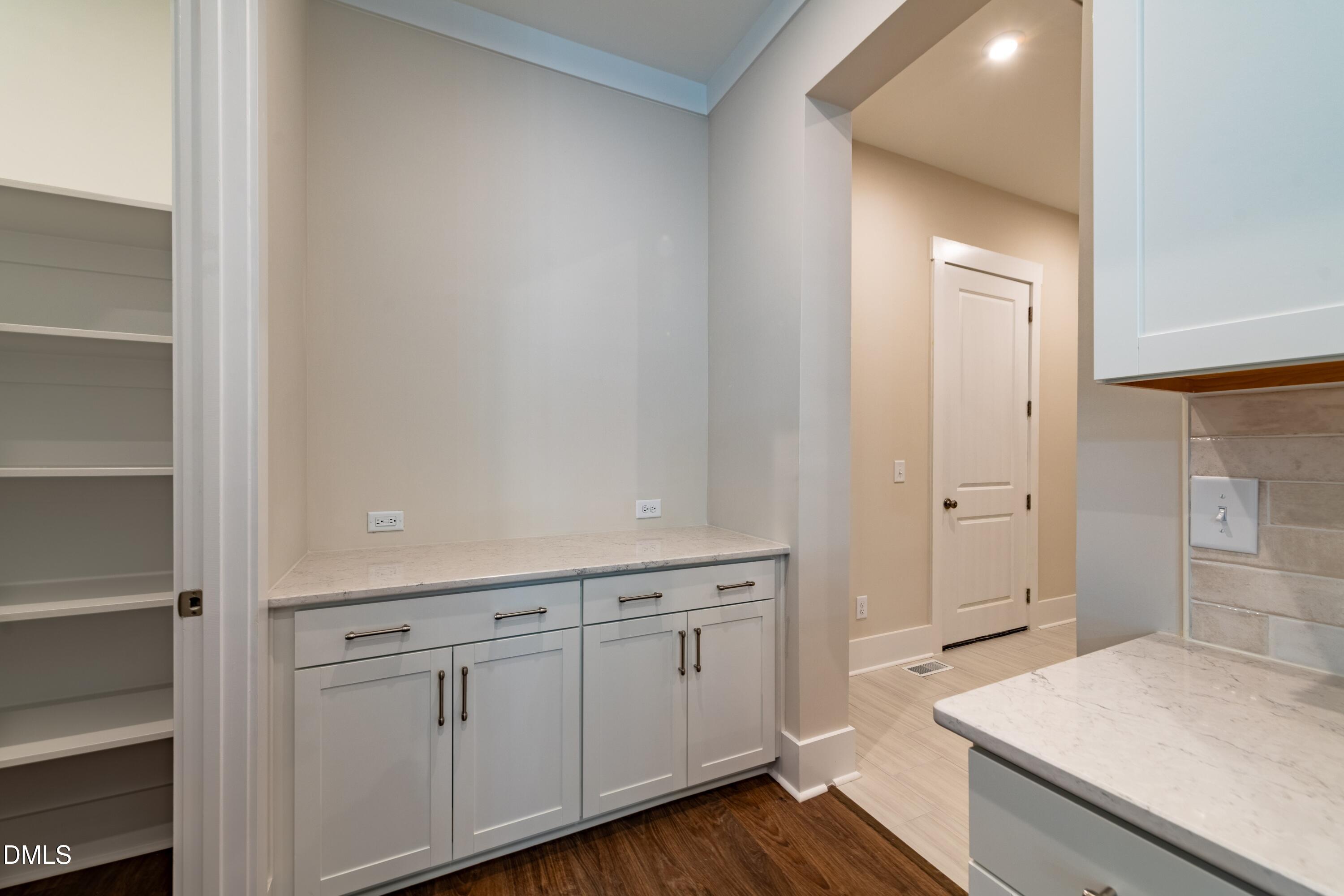 1 Wolf Tree Way Efland, NC 27243 - Photo 13 of 32 a view of a kitchen with wooden floor