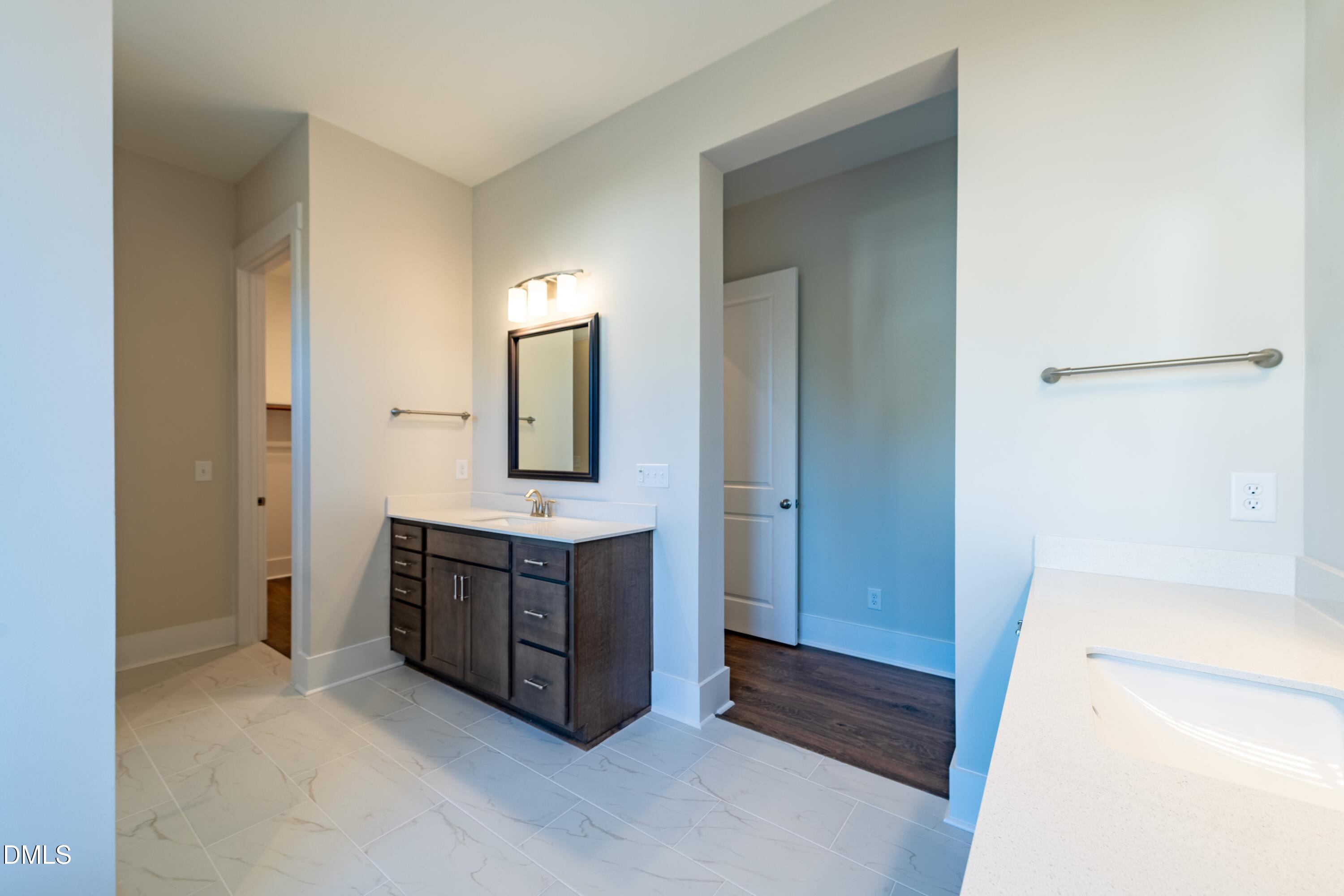 1 Wolf Tree Way Efland, NC 27243 - Photo 16 of 32 a bathroom with a sink and a mirror