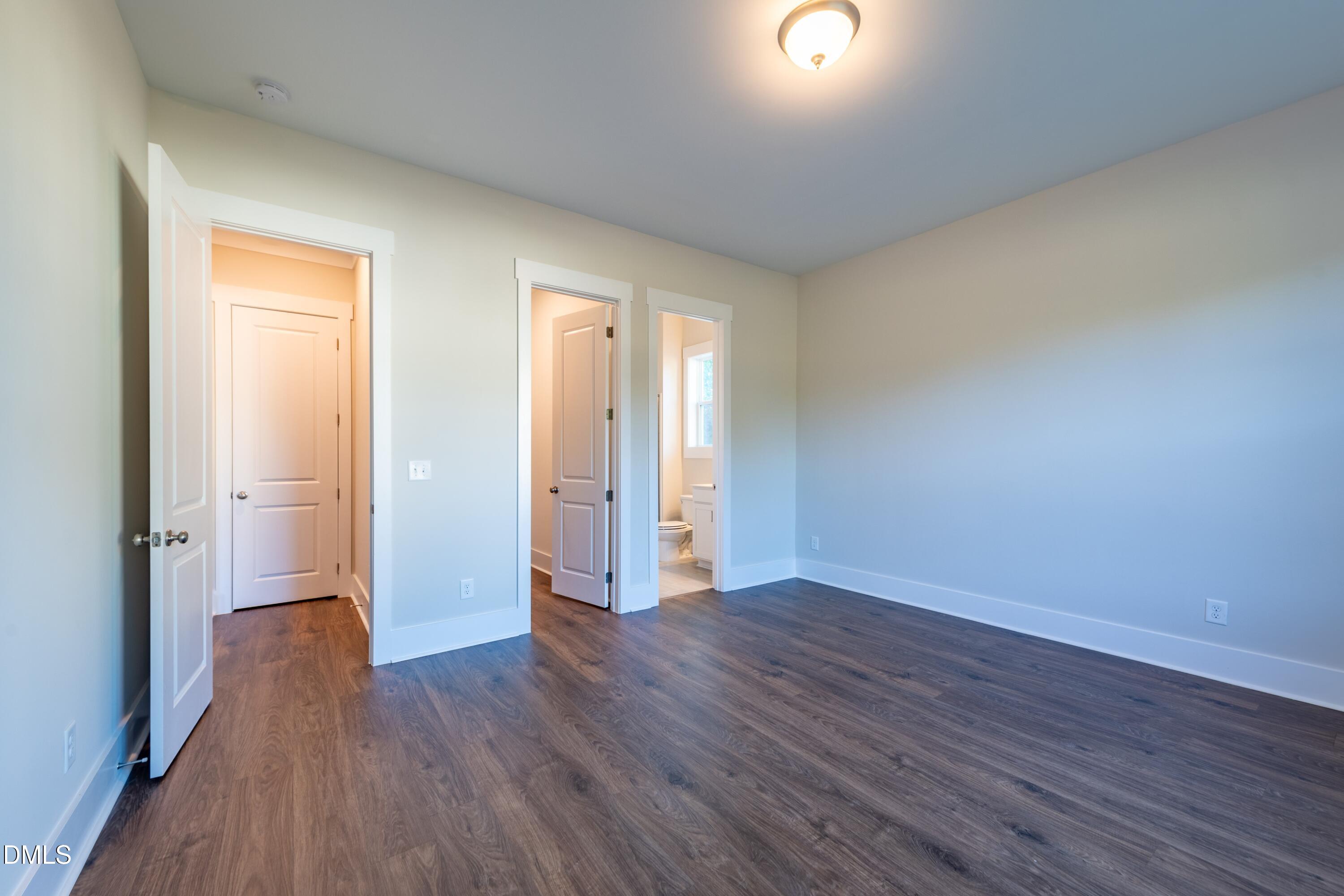 1 Wolf Tree Way Efland, NC 27243 - Photo 17 of 32 a view of an empty room with wooden floor