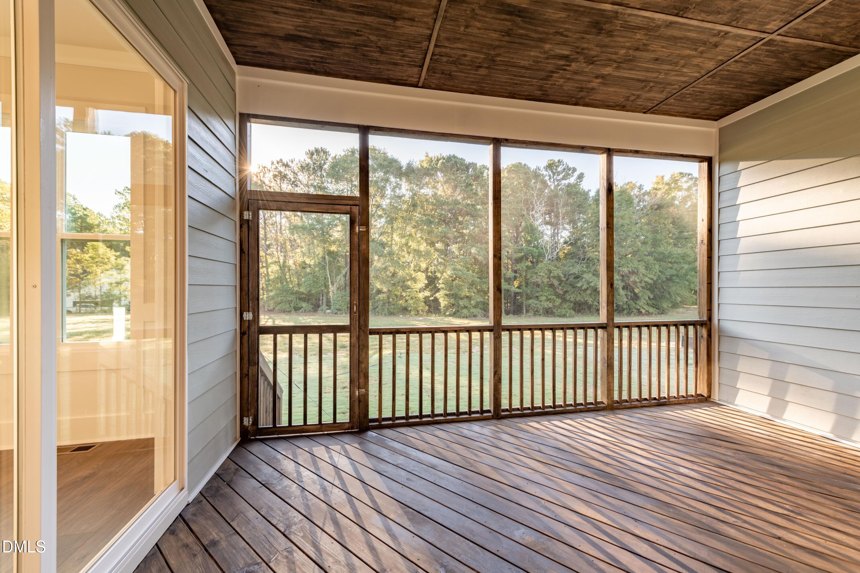 1 Wolf Tree Way Efland, NC 27243 - Photo 20 of 32 a view of a room with wooden floor and iron stairs