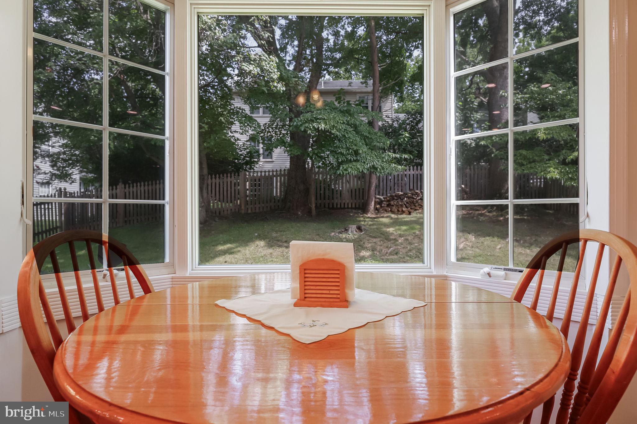 12705 Ruxton Road Silver Spring, MD 20904 - Photo 17 of 44 a view of a dining room with furniture window and outside view