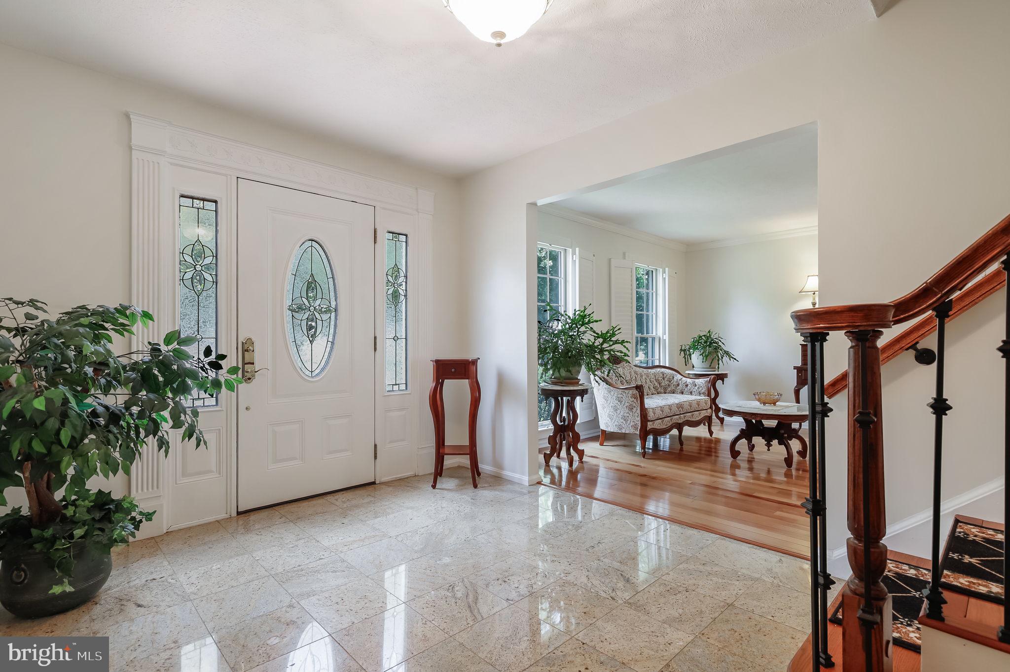 12705 Ruxton Road Silver Spring, MD 20904 - Photo 2 of 44 a view of a livingroom with furniture and a potted plant
