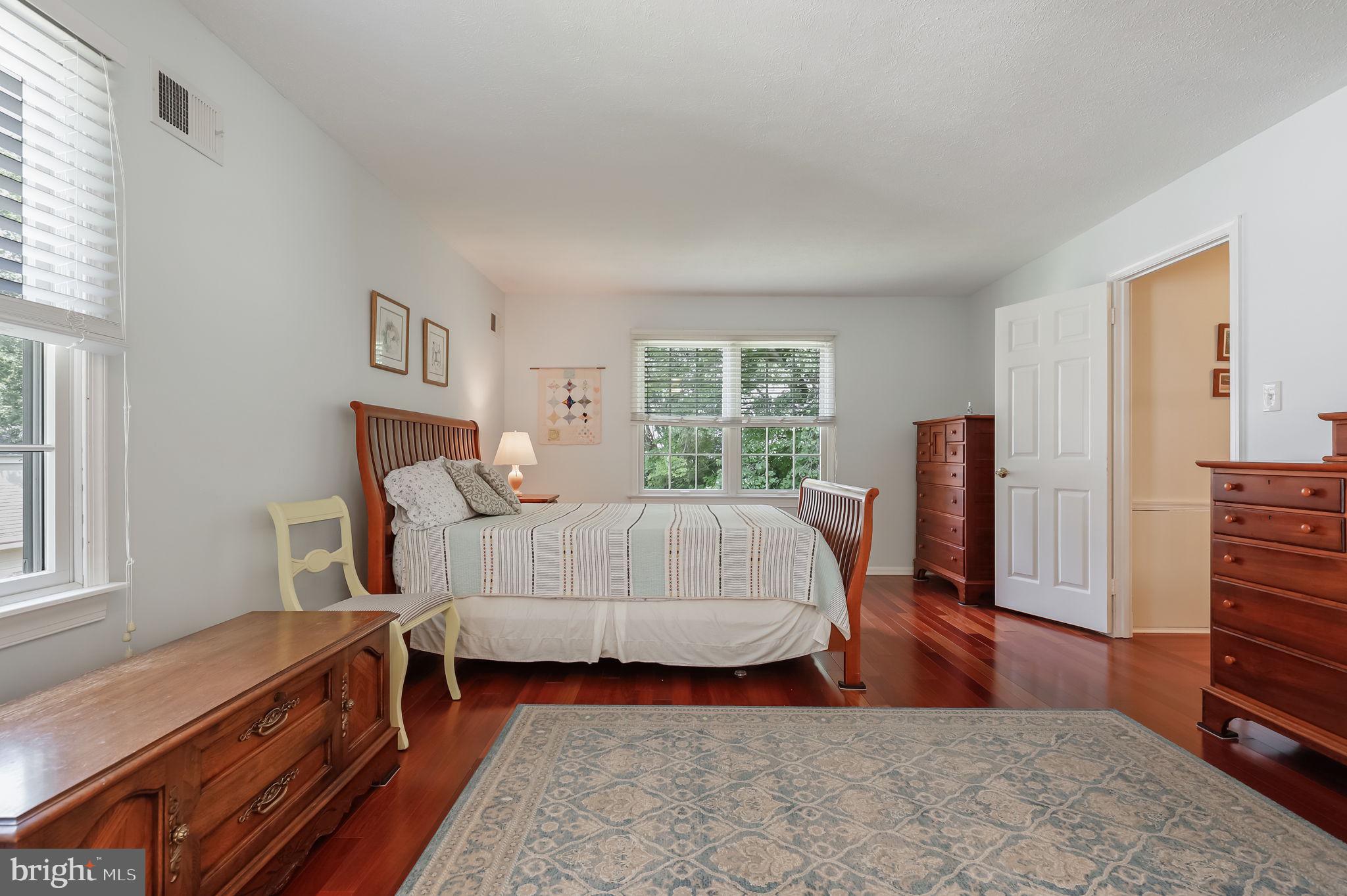 12705 Ruxton Road Silver Spring, MD 20904 - Photo 23 of 44 a bedroom with a bed and a dresser next to a window