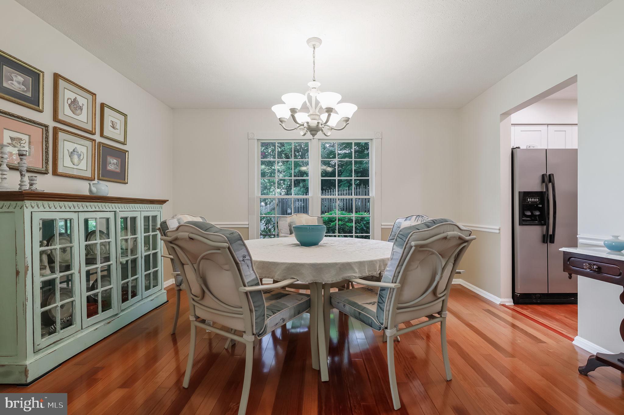 12705 Ruxton Road Silver Spring, MD 20904 - Photo 6 of 44 a view of a dining room with furniture window and wooden floor