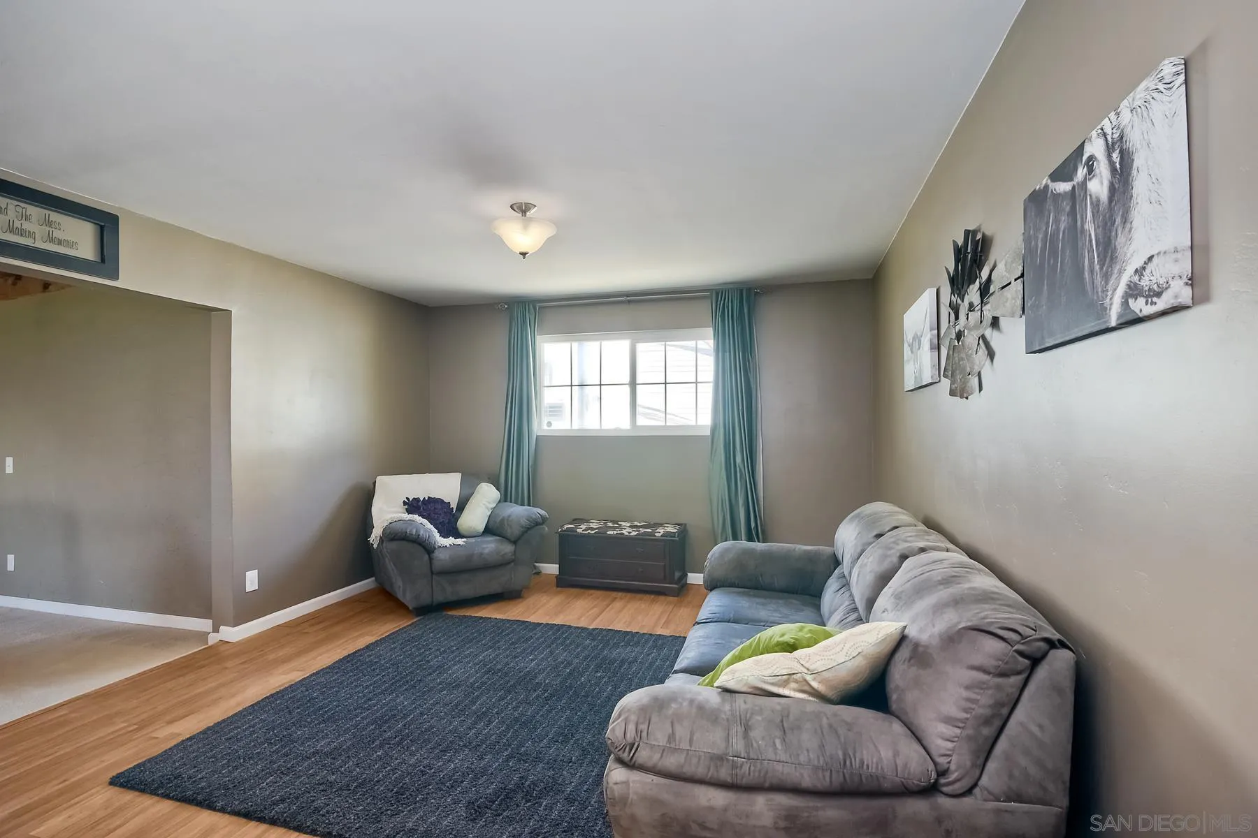2162 Rising Glen Way San Diego, CA 92139 - Photo 11 of 48 a living room with furniture and a window