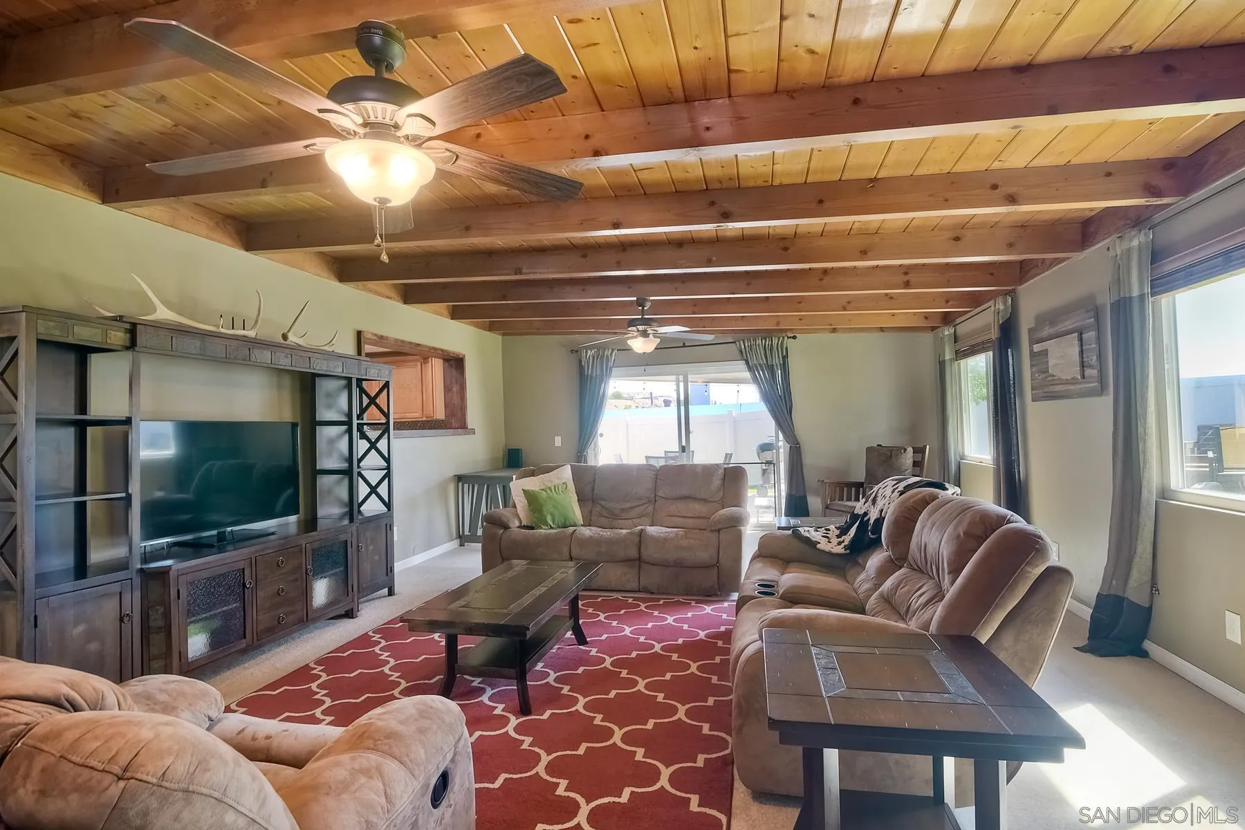 2162 Rising Glen Way San Diego, CA 92139 - Photo 14 of 48 a living room with furniture a flat screen tv and a chandelier