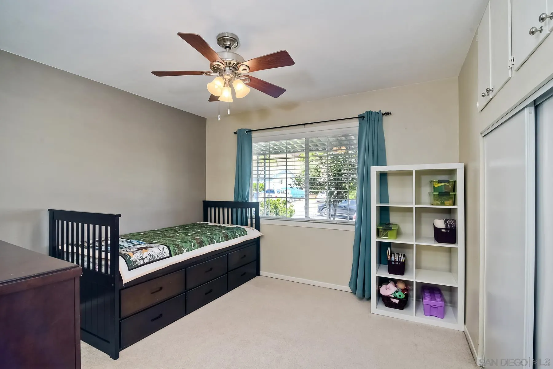 2162 Rising Glen Way San Diego, CA 92139 - Photo 18 of 48 a bedroom with a bed and a window