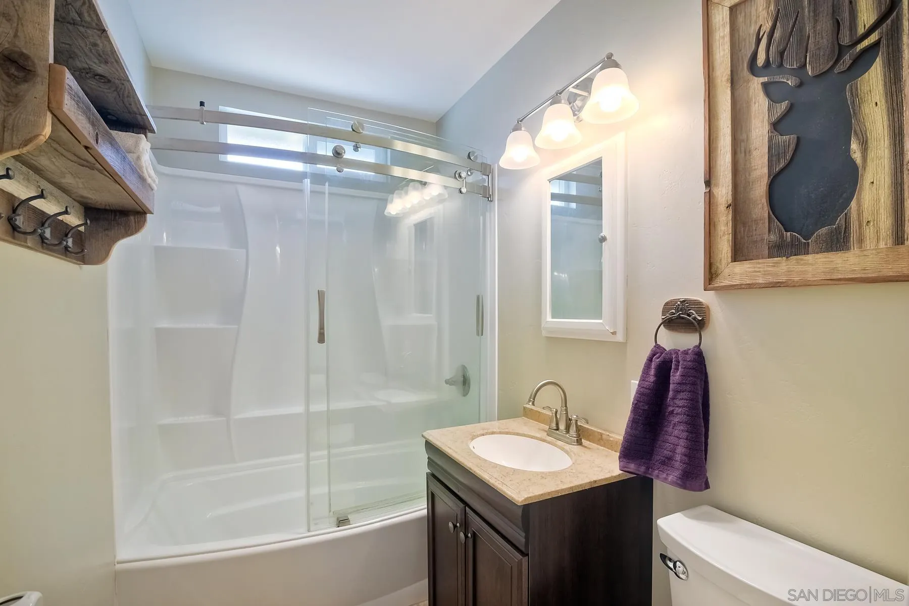 2162 Rising Glen Way San Diego, CA 92139 - Photo 20 of 48 a bathroom with a sink vanity tub and shower