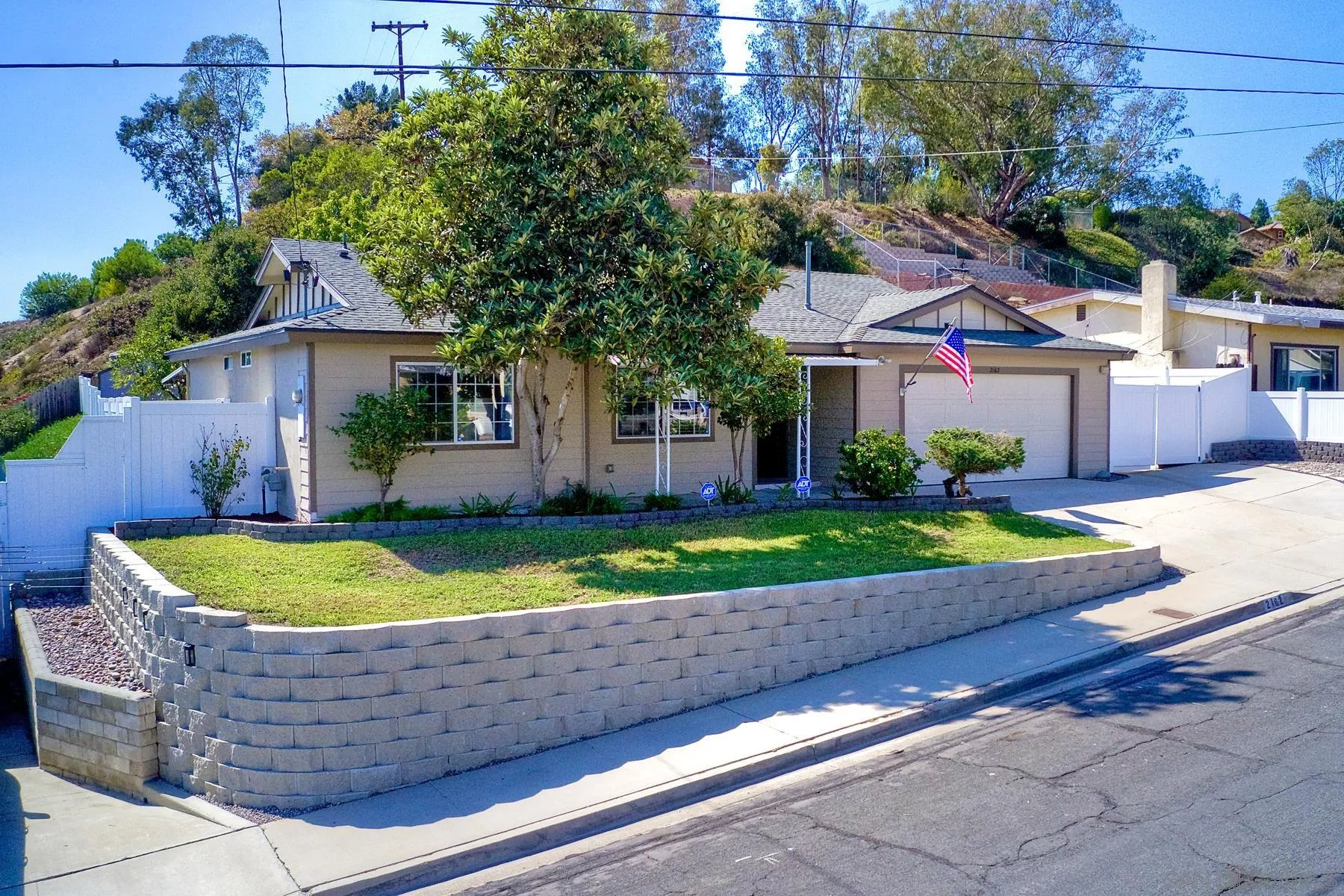 2162 Rising Glen Way San Diego, CA 92139 - Photo 2 of 48 a view of small house with a yard and potted plants