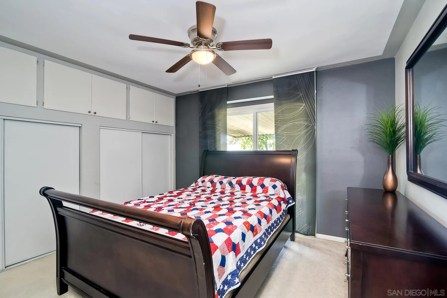2162 Rising Glen Way San Diego, CA 92139 - Photo 23 of 48 a bedroom with a bed and a chandelier