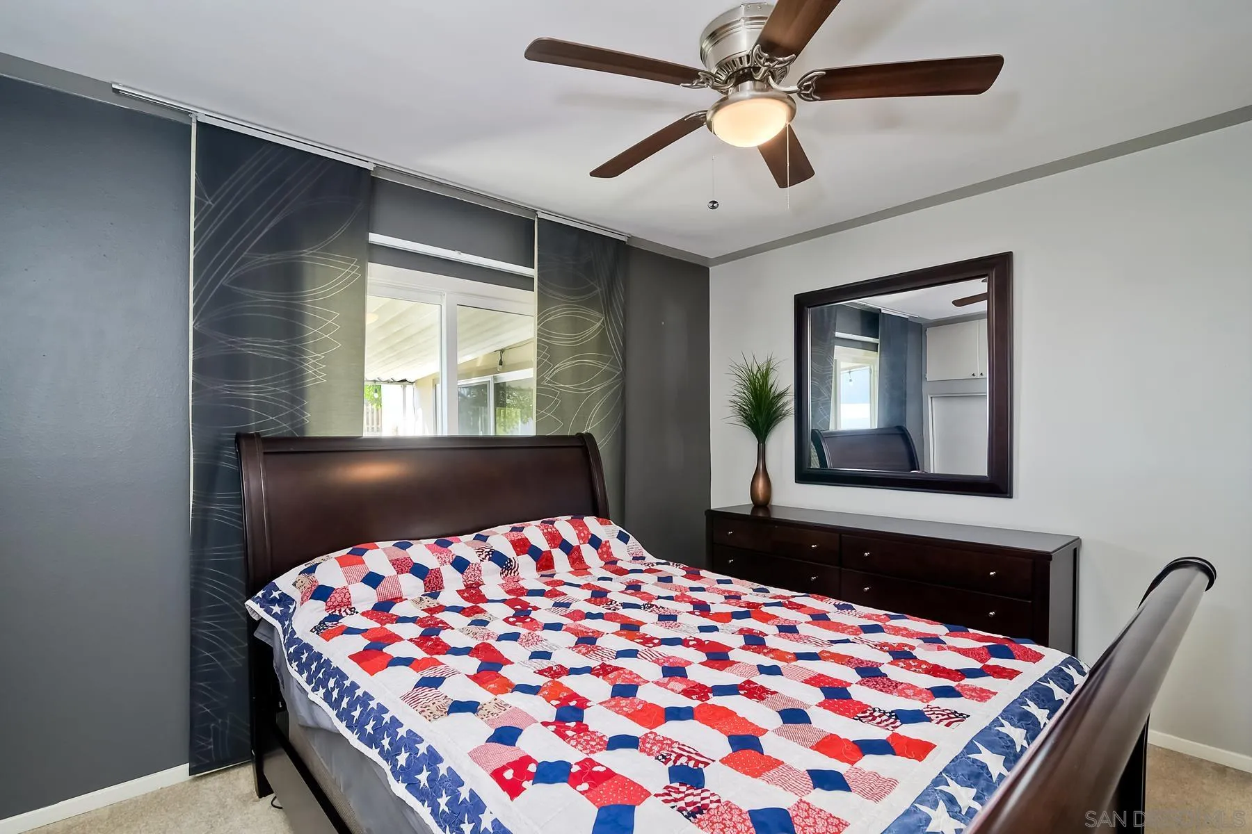 2162 Rising Glen Way San Diego, CA 92139 - Photo 24 of 48 a bedroom with a bed and a chandelier
