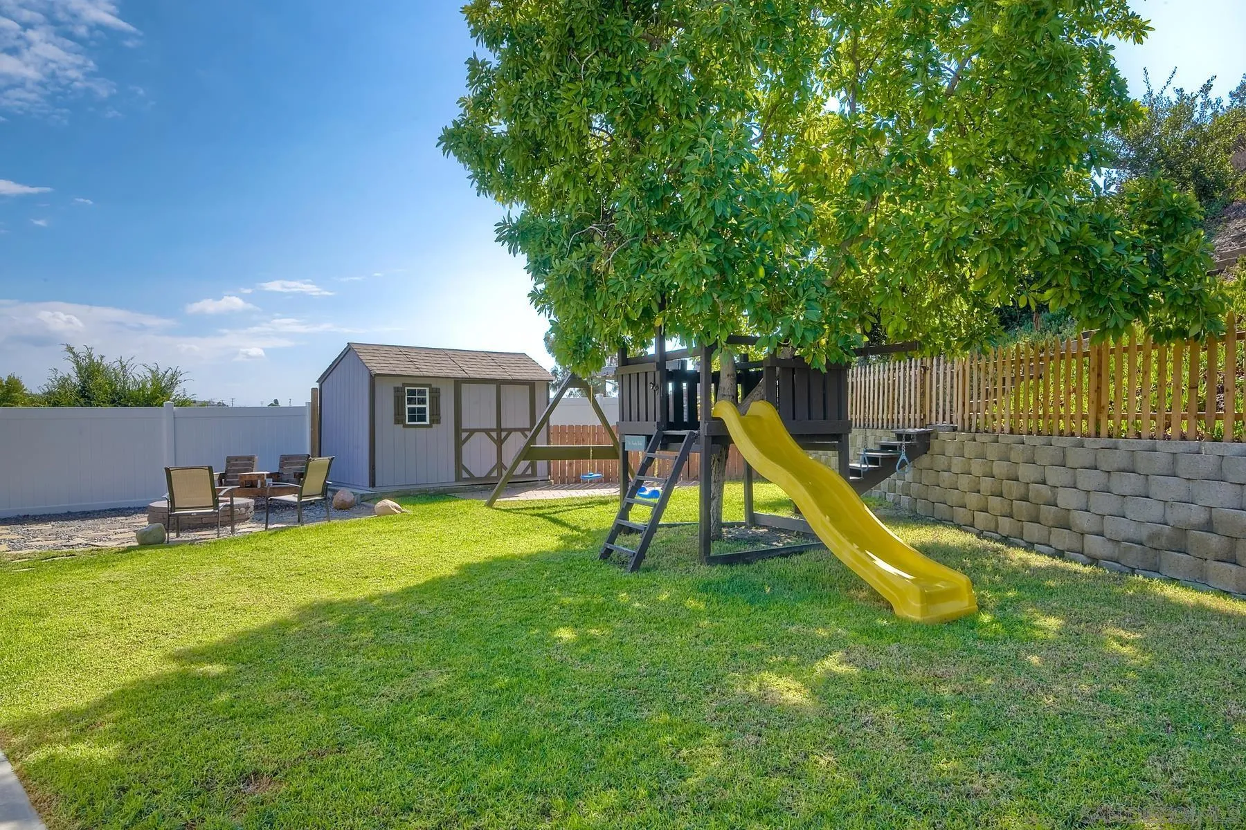 2162 Rising Glen Way San Diego, CA 92139 - Photo 27 of 48 a swimming pool with lots of tress in front of it
