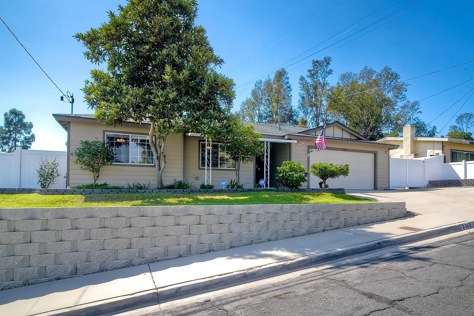 2162 Rising Glen Way San Diego, CA 92139 - Photo 36 of 48 a view of a house with a yard and a large tree