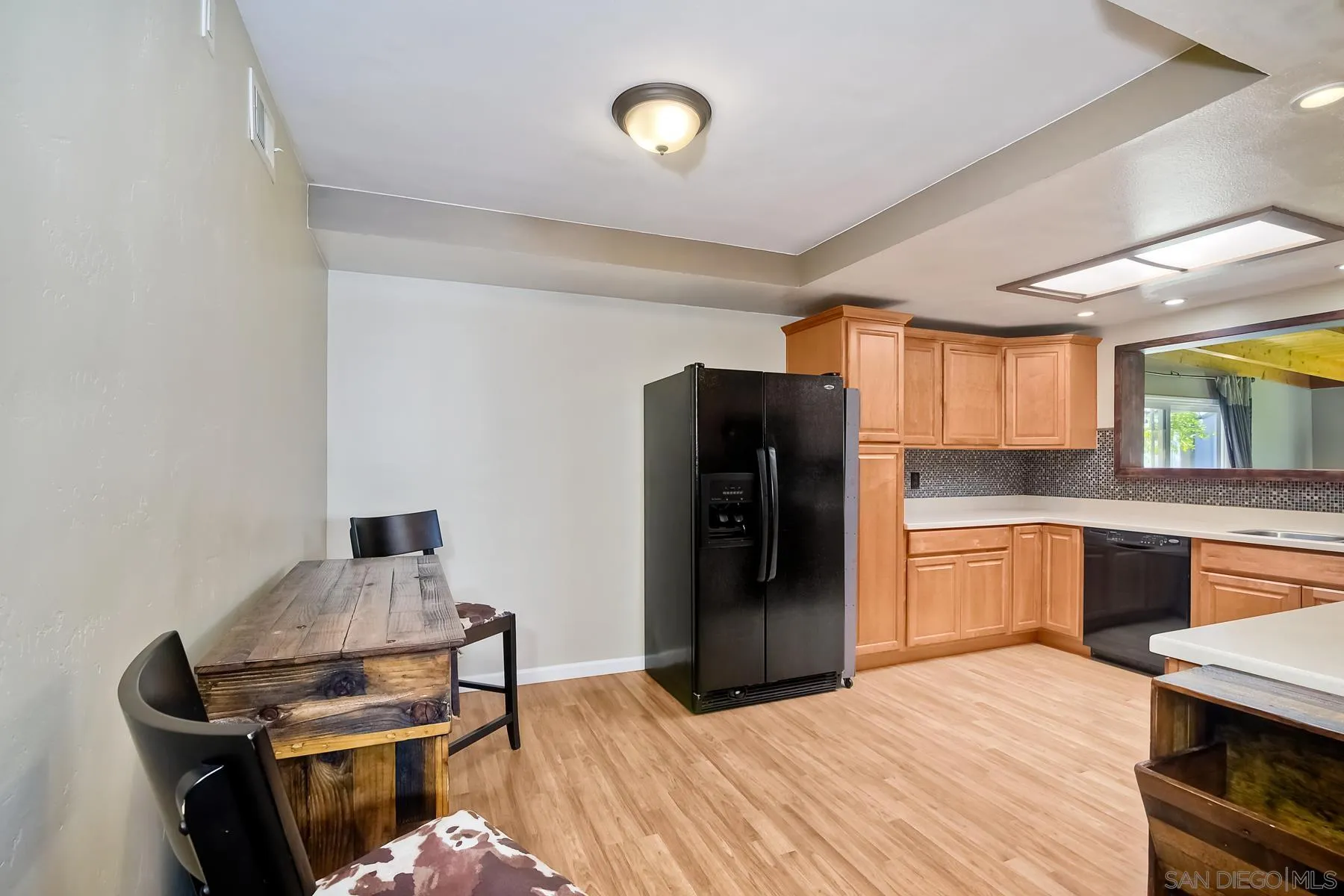 2162 Rising Glen Way San Diego, CA 92139 - Photo 7 of 48 a kitchen with a refrigerator and a stove top oven