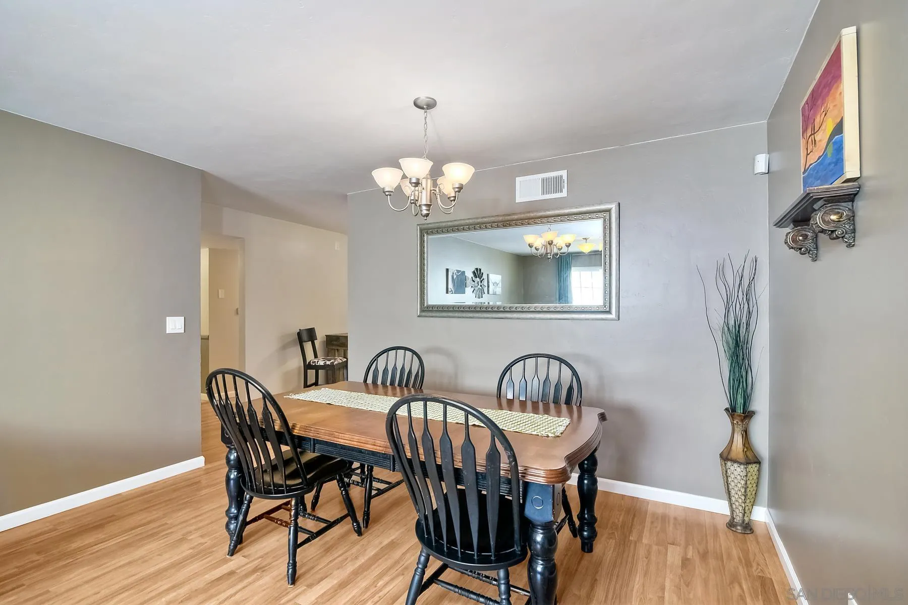 2162 Rising Glen Way San Diego, CA 92139 - Photo 9 of 48 a view of a dining room with furniture and wooden floor
