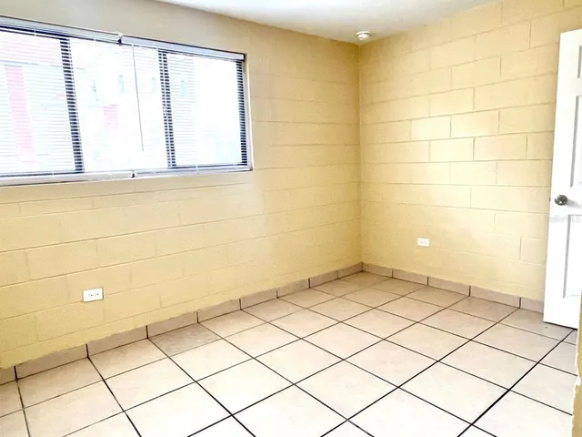 a view of a street with a building in the background