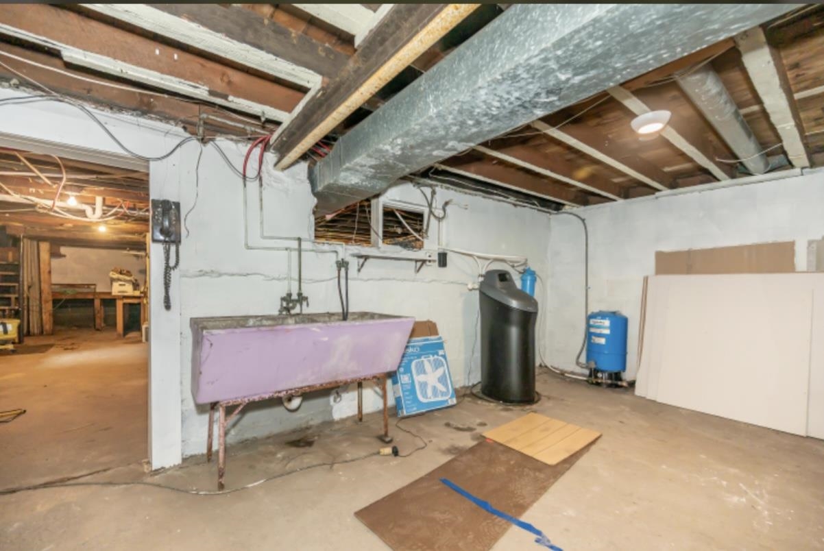 126 Jay Cooke Road Esko, MN 55733 - Photo 16 of 19 Unfinished below grade area featuring a water pressure tank and a water softener system