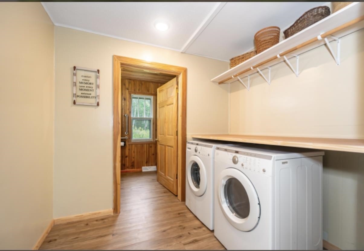 126 Jay Cooke Road Esko, MN 55733 - Photo 17 of 19 Laundry room with light wood-style floors, separate washer and dryer, and recessed lighting