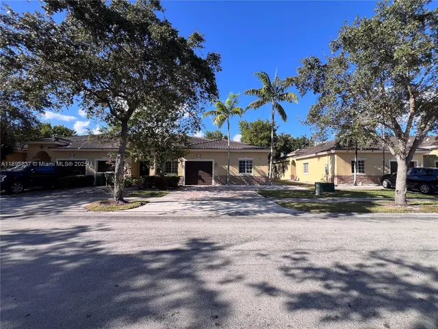 a white toilet sitting next to a shower curtain