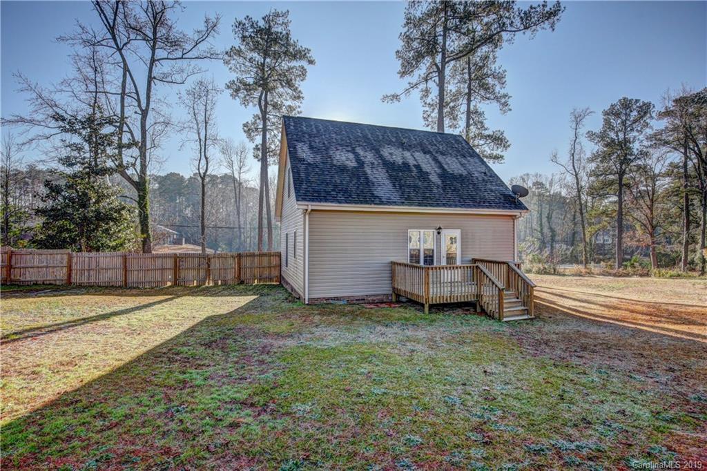 311 Roberdell Road, Unit A/B Rockingham, NC 28379 - Photo 22 of 29 a front view of a house with a yard and garage