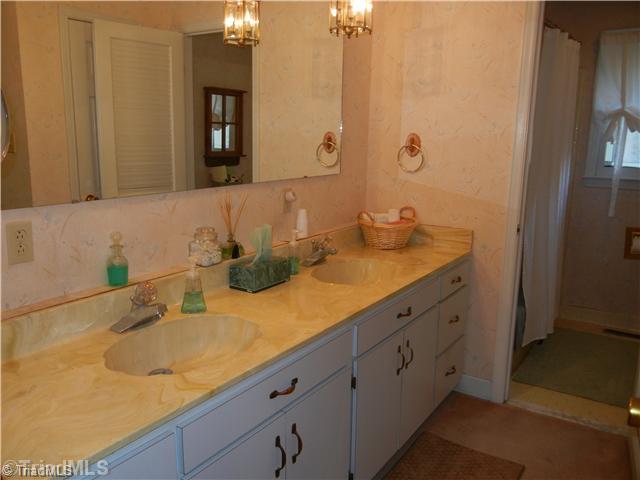 6307 Nat Road Julian, NC 27283 - Photo 11 of 15 Bath. Large bath with double sinks and spacious built in shelves and cabinets (not shown)