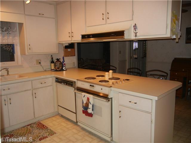 6307 Nat Road Julian, NC 27283 - Photo 5 of 15 Kitchen. Spacious kitchen with loads of cabinets and sit down bar
