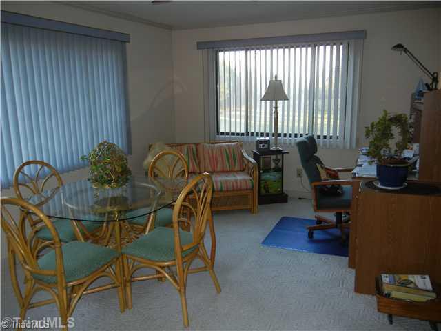 6307 Nat Road Julian, NC 27283 - Photo 8 of 15 Sunroom. Bright and sunny office and/or sitting room with outside entrance.