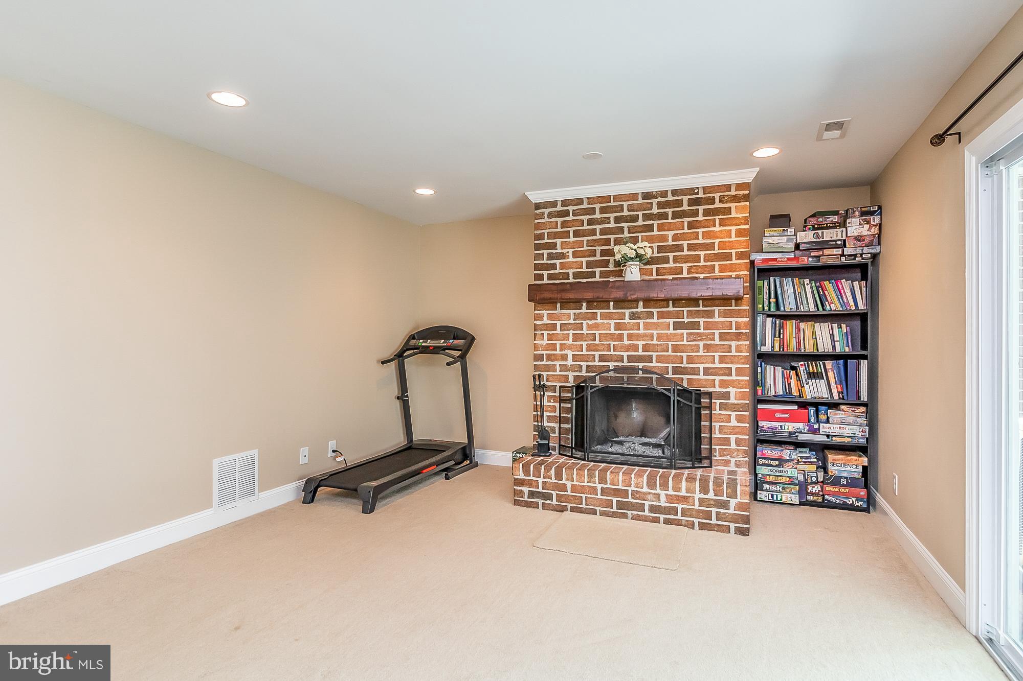 9705 Parkland Road Baltimore, MD 21234 - Photo 32 of 44 Attractive brick hearth fireplace