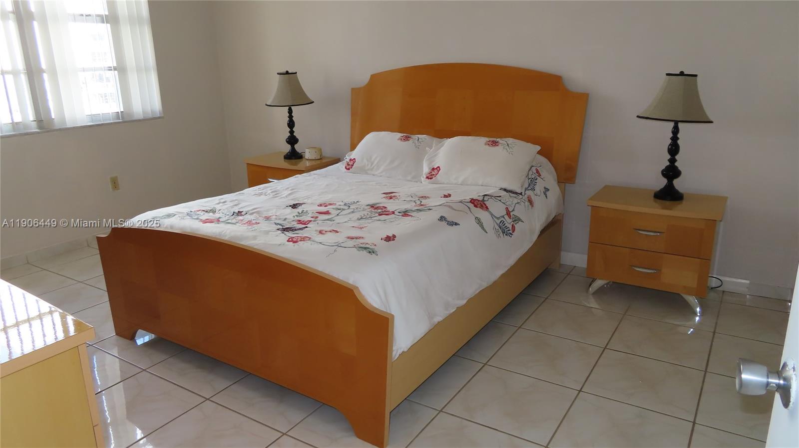 5701 Collins Avenue, Unit 511 Miami Beach, FL 33140 - Photo 16 of 51 a bed sitting in a bedroom next to a window