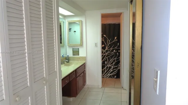 a view of balcony with a potted plant and outdoor seating