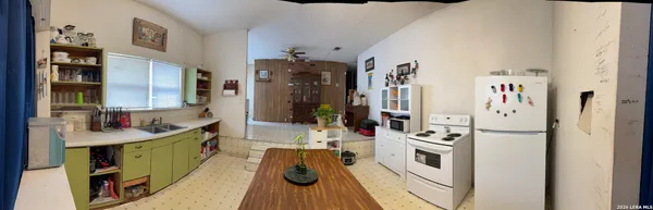 a view of a kitchen and utility room