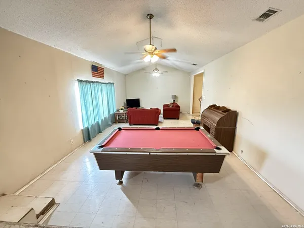 a room with furniture and chandelier