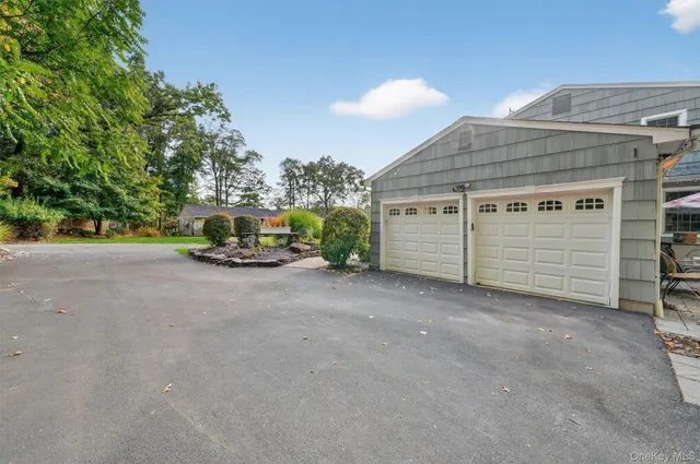 a view of a street with a building in the background