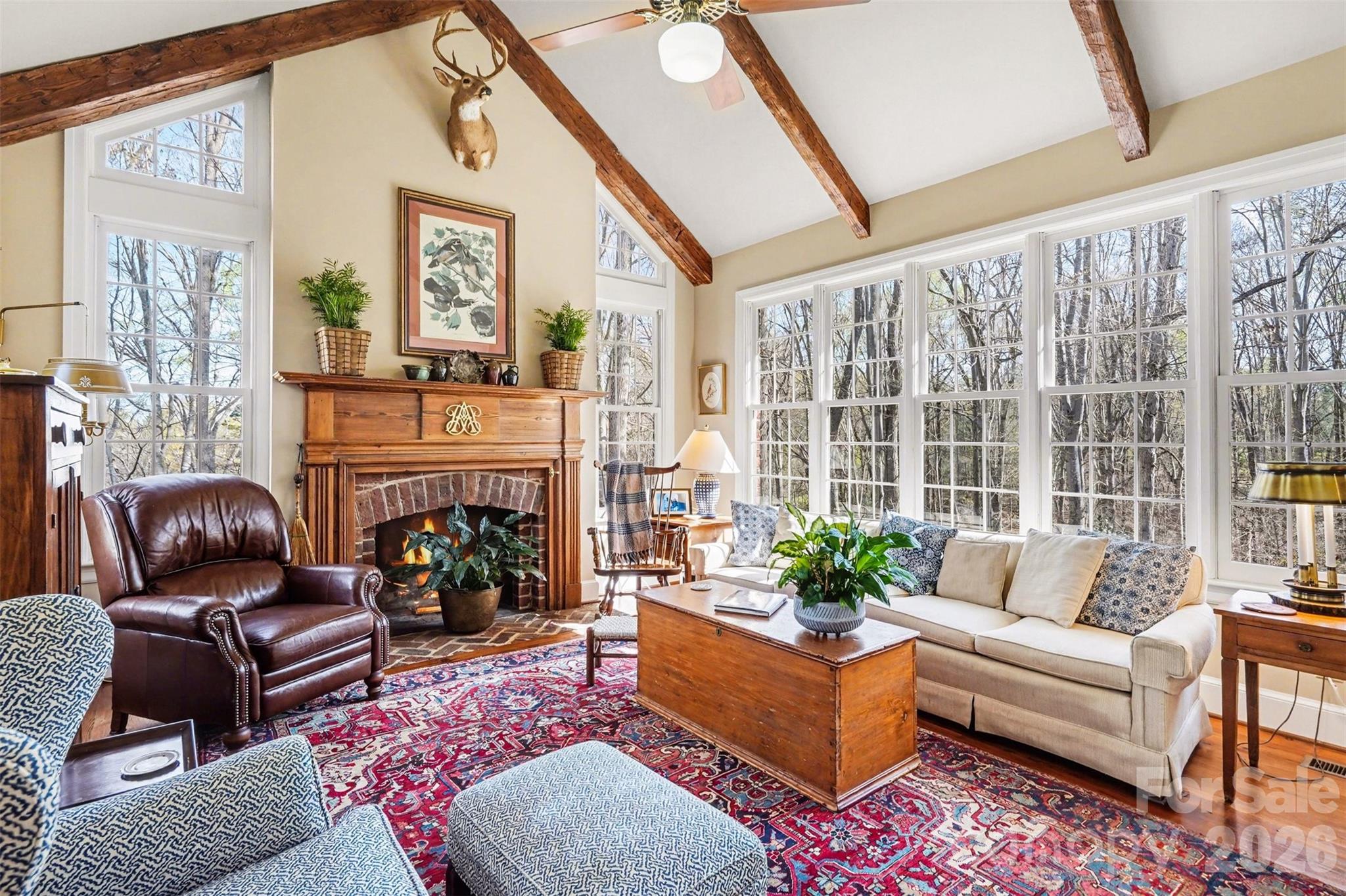 212 Deer Chase Road Shelby, NC 28150 - Photo 16 of 40 a living room with furniture fireplace and a large window