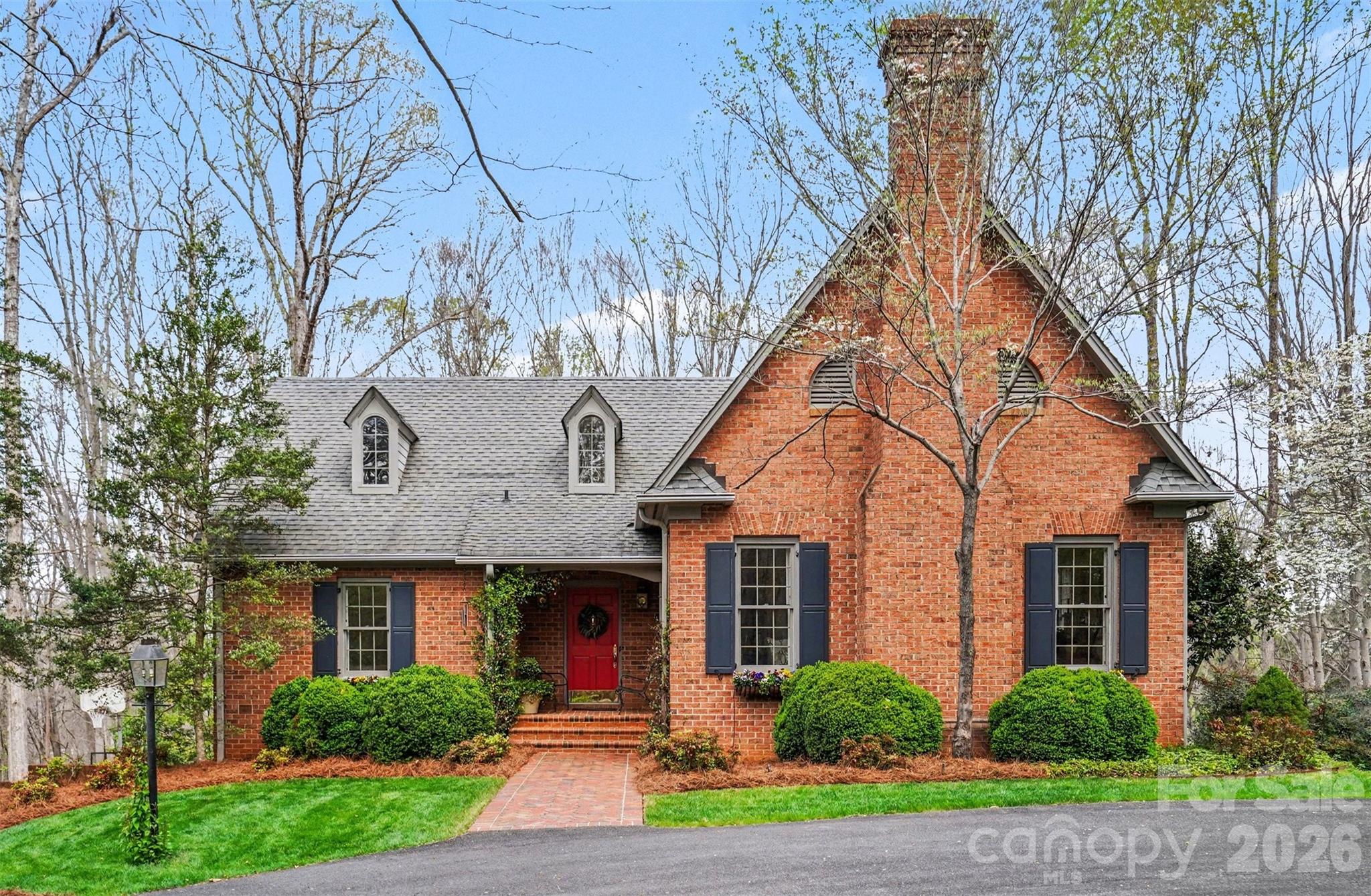 212 Deer Chase Road Shelby, NC 28150 - Photo 2 of 40 a front view of a house with a yard and potted plants